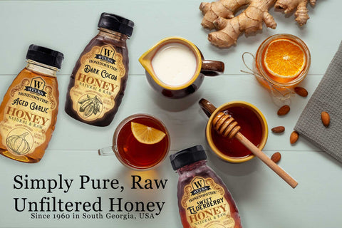 Honey bottles and honeycomb on a light blue background with text about honey quality.