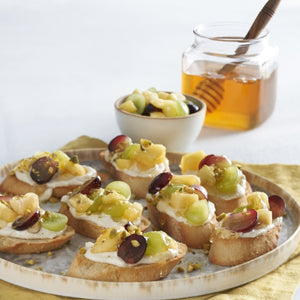 Mediterranean Bruschetta with Honey Orange Ricotta and Roasted Pistachios
