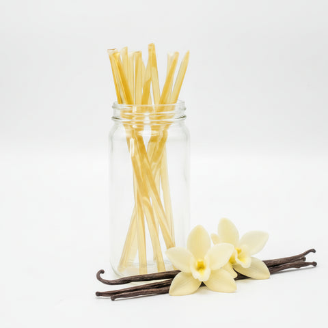 Clear glass jar filled with yellow straws on a white background, with 'Vanilla' written in red.